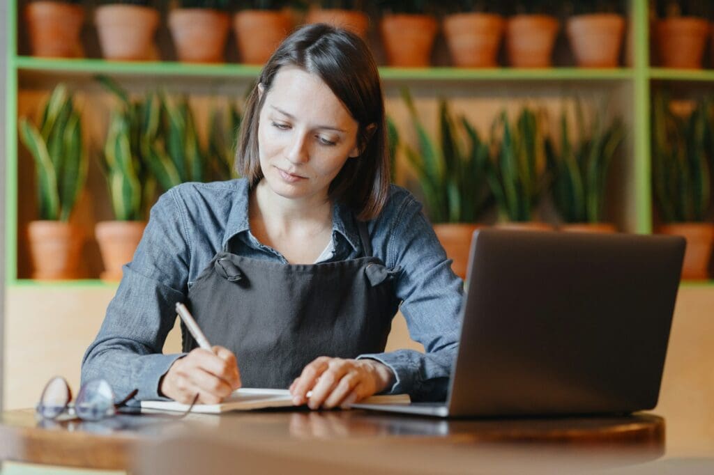 restaurant business or coffee shop. a female entrepreneur works in a restaurant and sends orders